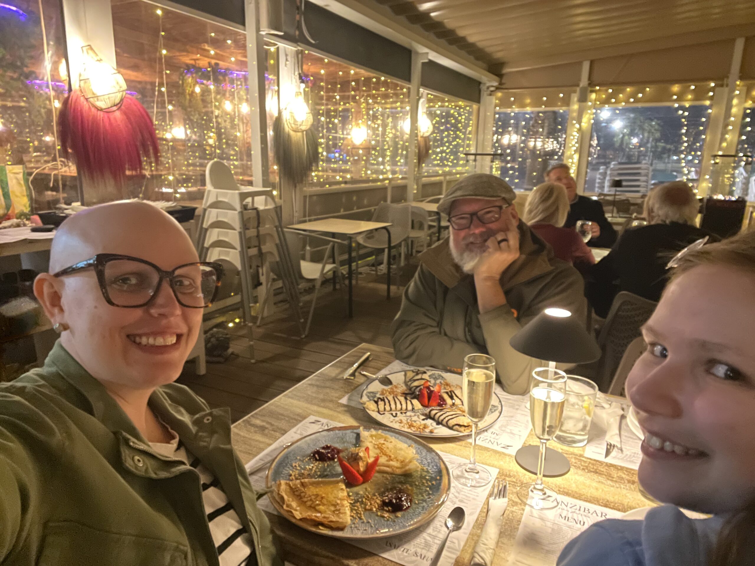 Family of three eating dinner in Spain